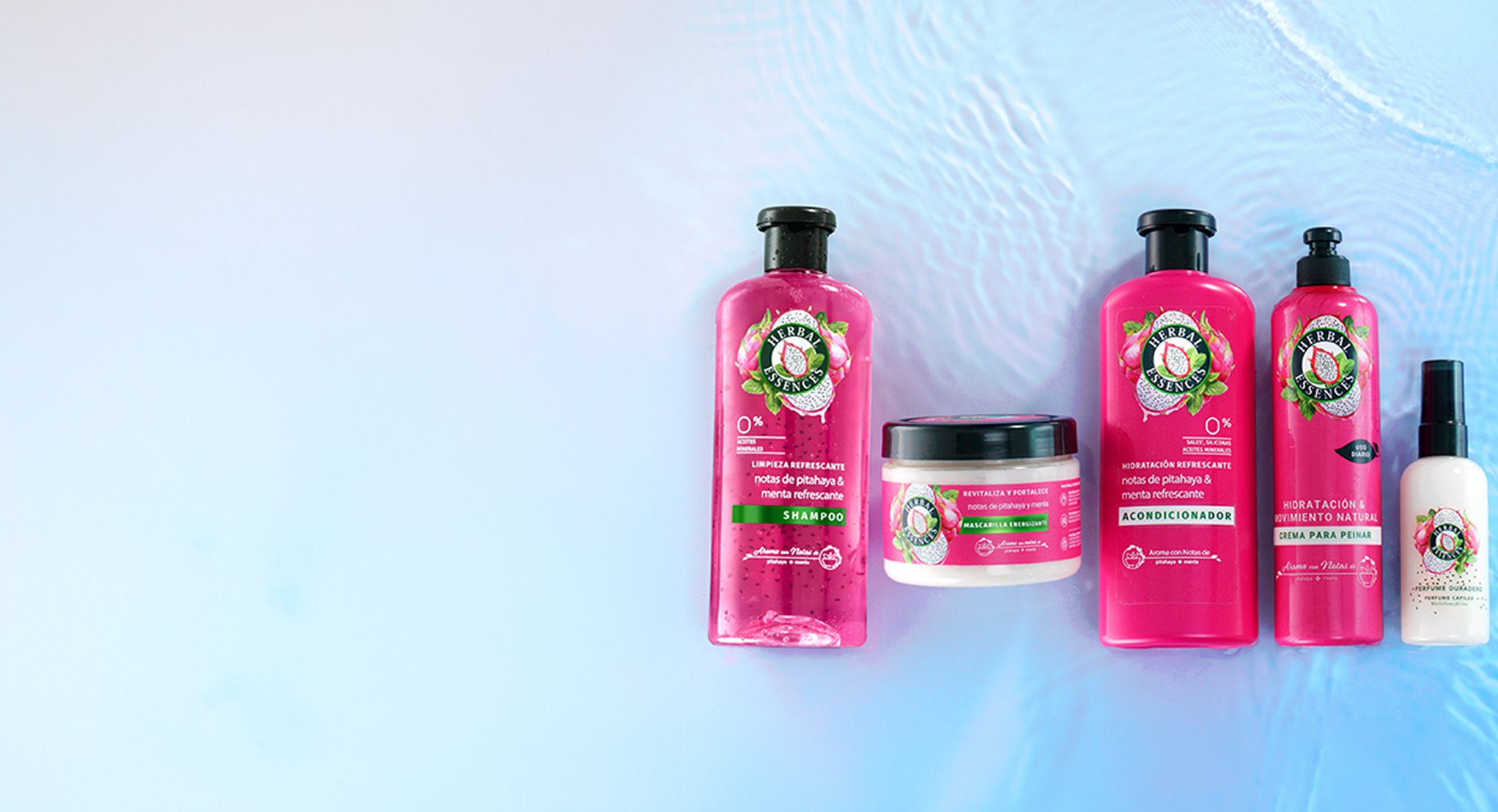 Colección completa Herbal Essences Pitahaya y Menta con shampoo, acondicionador, mascarilla y crema para peinar sobre fondo azul acuático